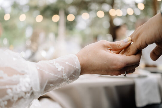 Elegant wedding ceremony with intimate ring exchange at outdoor venue