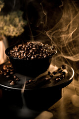 Coffee beans on a black background showcasing rich textures and aromatic qualities in a close-up display