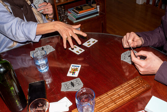 Anonymous hands playing cards