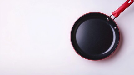 A non-stick frying pan isolated on a white background. This fry pan is a modern kitchen utensil used for cooking. It represents the concept of cooking and can be used as a mockup for advertising