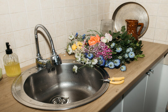 Flowers in a kitchen sink
