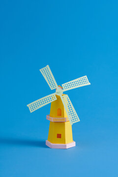 Colorful Paper Windmill Against blue Background