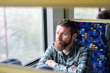 handsome man traveling on a train
