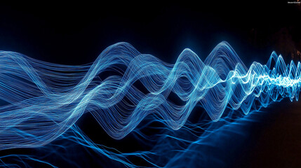 Fototapeta premium Abstract blue light trails creating wavy pattern on black background