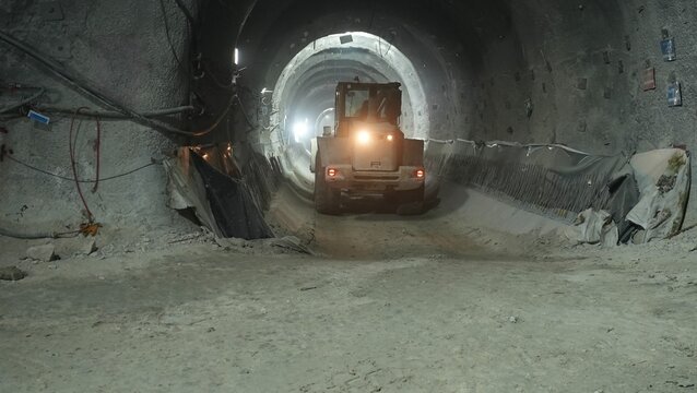 bulldozer driving in subway tunnel