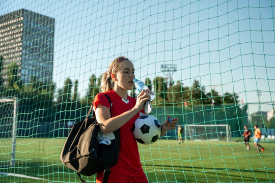 Fototapeta Female soccer player on a sports field