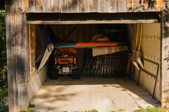 Wooden garage for storing seasonal outdoor equipment 