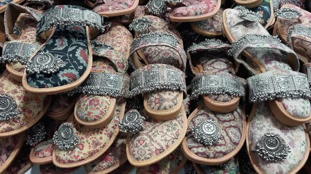 Ladies' designer chappals from Kolhapur are sold in the Indian market