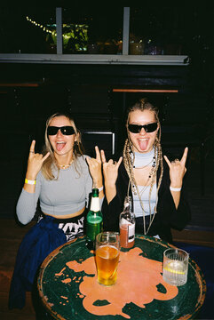 Two friends having fun at a lively bar