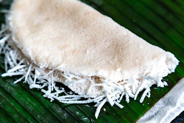 Traditional Brazilian tapioca with coconut served on a banana leaf. Amazonian tapioca