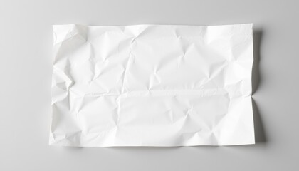 Fototapeta premium Realistic wrinkled paper mockup with soft folds and texture, placed on smooth neutral background, with lighting emphasizing natural wrinkles