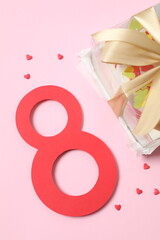 Colorful cake decorated with red lips  and number Eight on color background