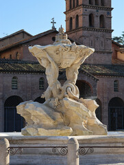 The Fountain of the Tritons, in the background the basilica of Santa Maria in Cosmedin.
Rome Forum Boarium, Piazza Bocca della Verità.	