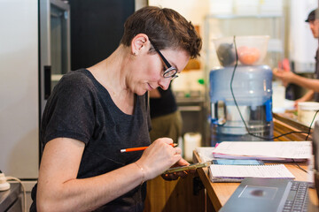 Cookie shop clerk taking delivery orders