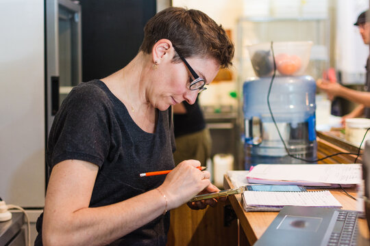 Cookie shop clerk taking delivery orders