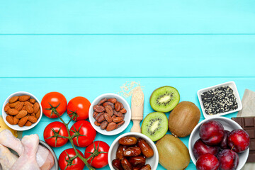 Different products rich in serotonin on light blue wooden table, flat lay. Space for text