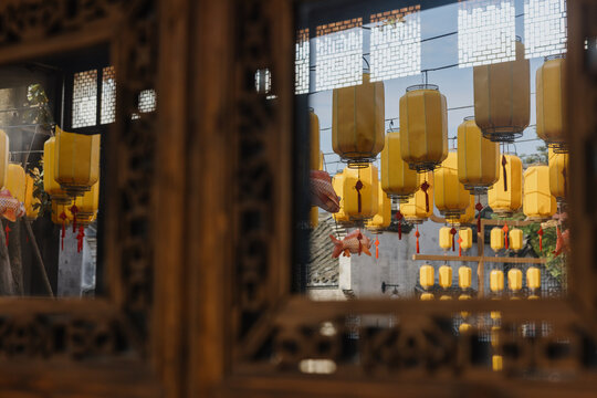 Yellow Lanterns Reflected in Traditional Window