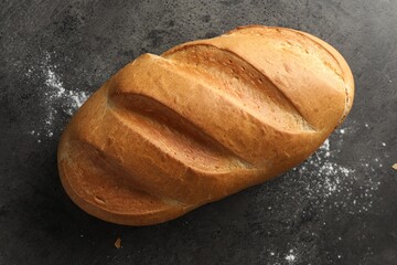 Freshly baked bread on grey table, top view