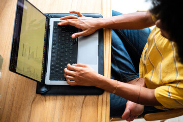 Black woman working at laptop
