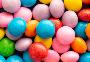 Closeup top view of colorful candies. Candy backdrop