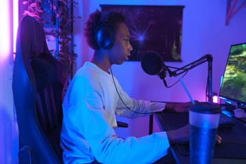 Side View of Gamer Streaming at Desk