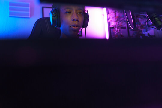 Gamer Streaming with Headphones and Neon Lighting