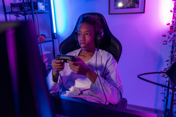 Teen Gamer Concentrating on Screen with Controller