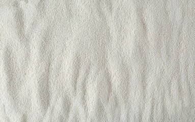 Pile of uncooked organic semolina background and texture	