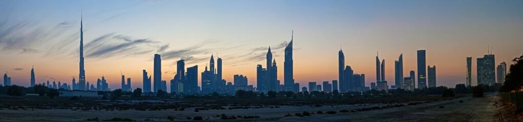 Fototapeta premium Dubai skyline at sunset with modern skyscrapers