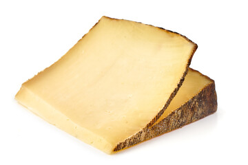 Rustic cheese wedge, isolated on white background.