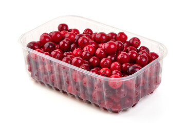 Fresh red cranberries isolated on white background.