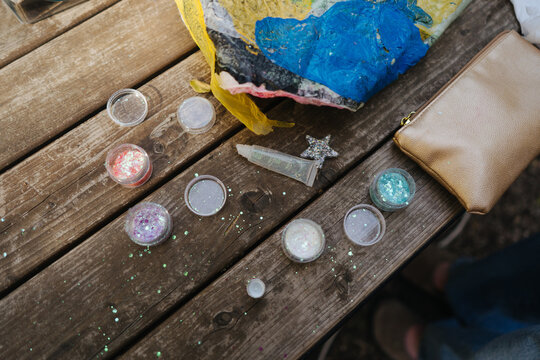 Different glitter on a wooden bench