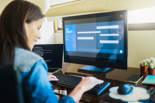 AI chat bot, Programmer using generative artificial intelligence for interface development on computer, Virtual chatBot technology trend - Powered by Adobe