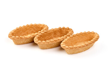 Empty tartlet shells, isolated on white background.