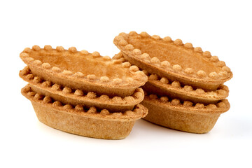 Empty tartlet shells, isolated on white background.