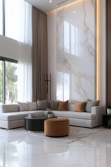 A large living room with a white wall and a white couch. The couch is covered in pillows and a coffee table is in the middle of the room. The room has a modern and elegant feel to it