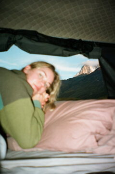 Cozy morning in a tent overlooking scenic mountains at sunrise