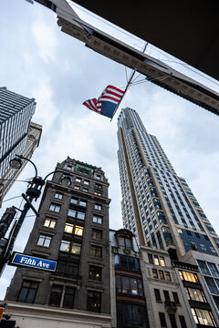 American flag waving over fifth avenue in manhattan, new york city
