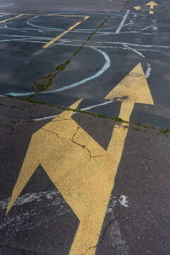 Yellow Arrow Marking on Asphalt