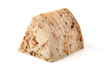 Seasoned cheese wedge with herbs and spices, isolated on white background.