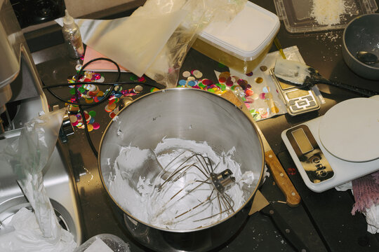 Mixing ingredients for a sweet dessert in a busy kitchen 