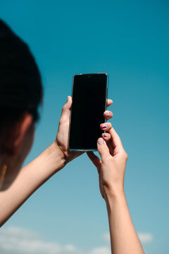 Woman's hands holding phone