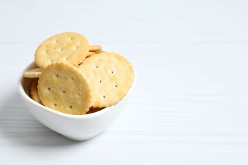 Delicious crispy crackers cookies in a plate on white background 