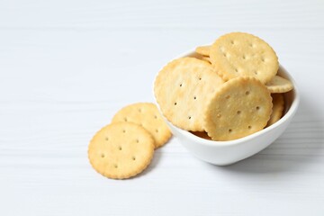 Delicious crispy crackers cookies in a plate on white background 