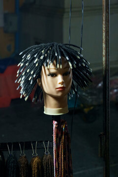 Mannequin head with cornrow braids