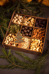many nuts in wooden gift box for christmas as christmas background