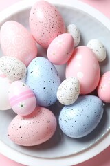 Easter eggs in a plate on color background