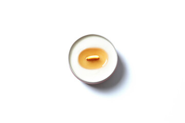Aromamic candle burning on white background 