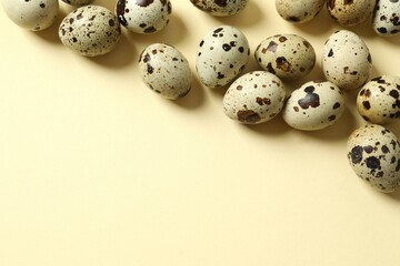 Quail eggs on color background