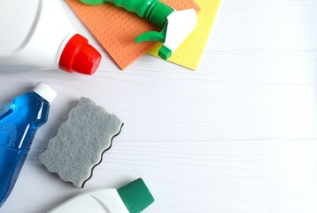 Many different cleaning products on white background, top view